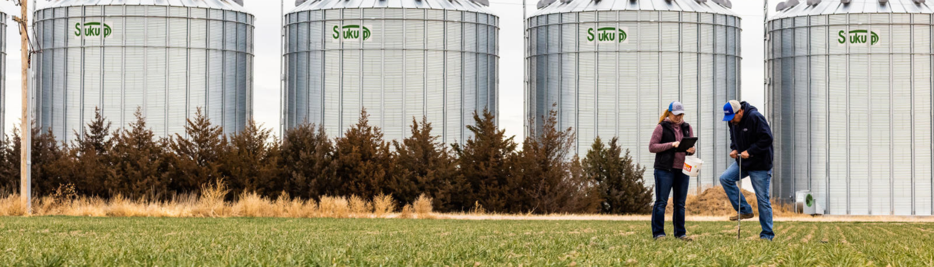 Two people working in a field
